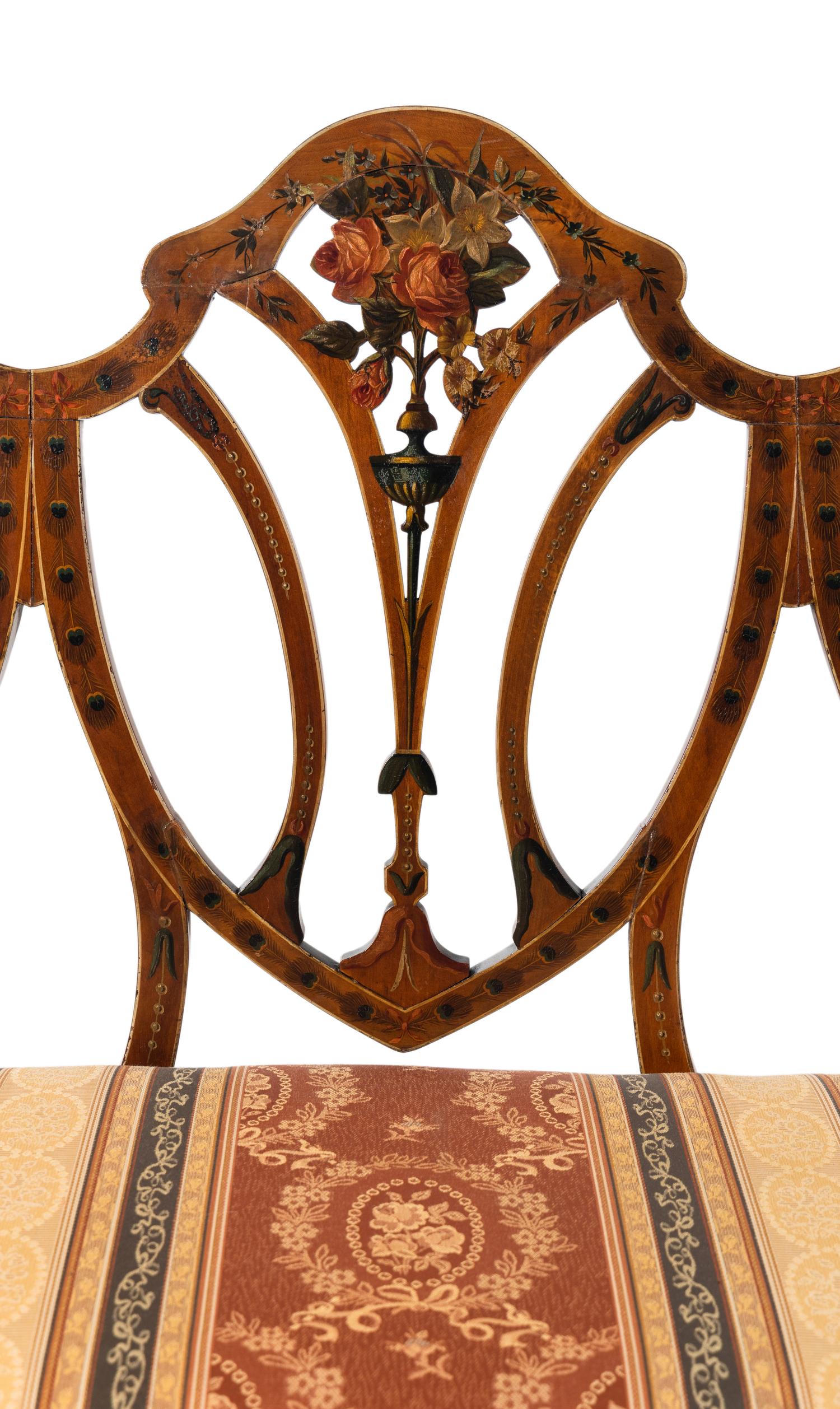 An Edwardian Painted Satinwood Triple-Back Settee and Armchair