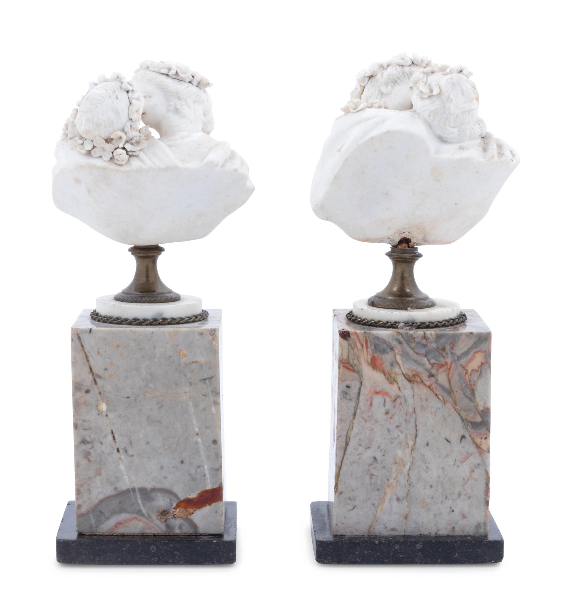 A Pair of Bisque Busts on Marble Bases