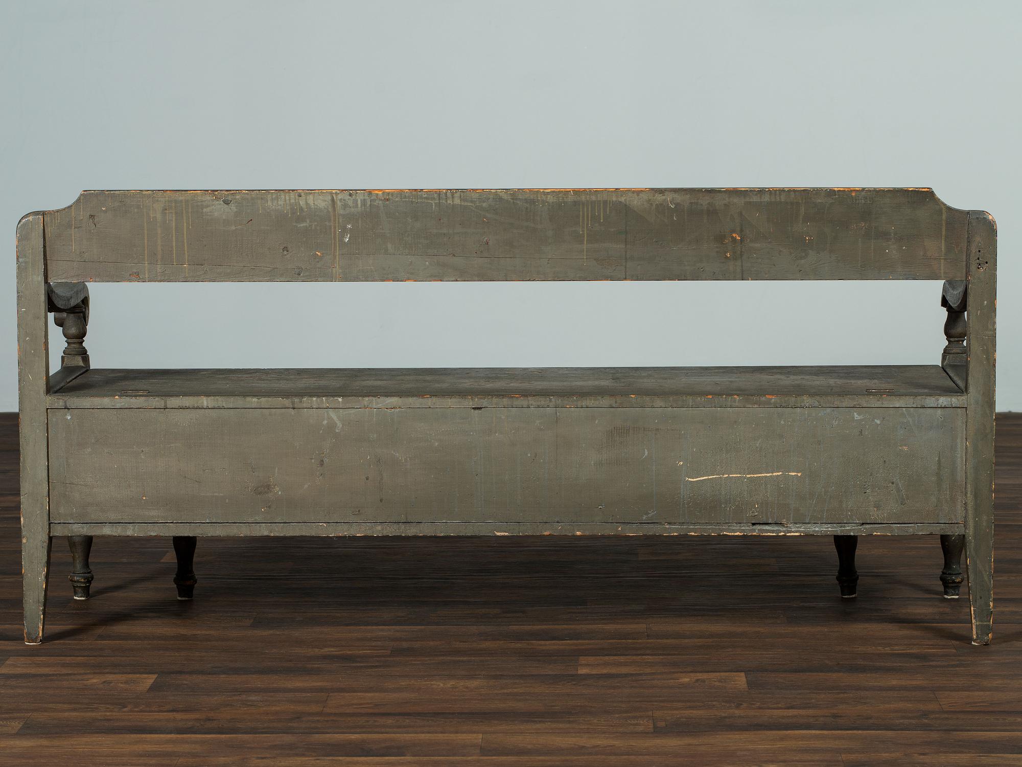 A Swedish-American Green Painted Pine Country Tavern Bench and Trundle Bed