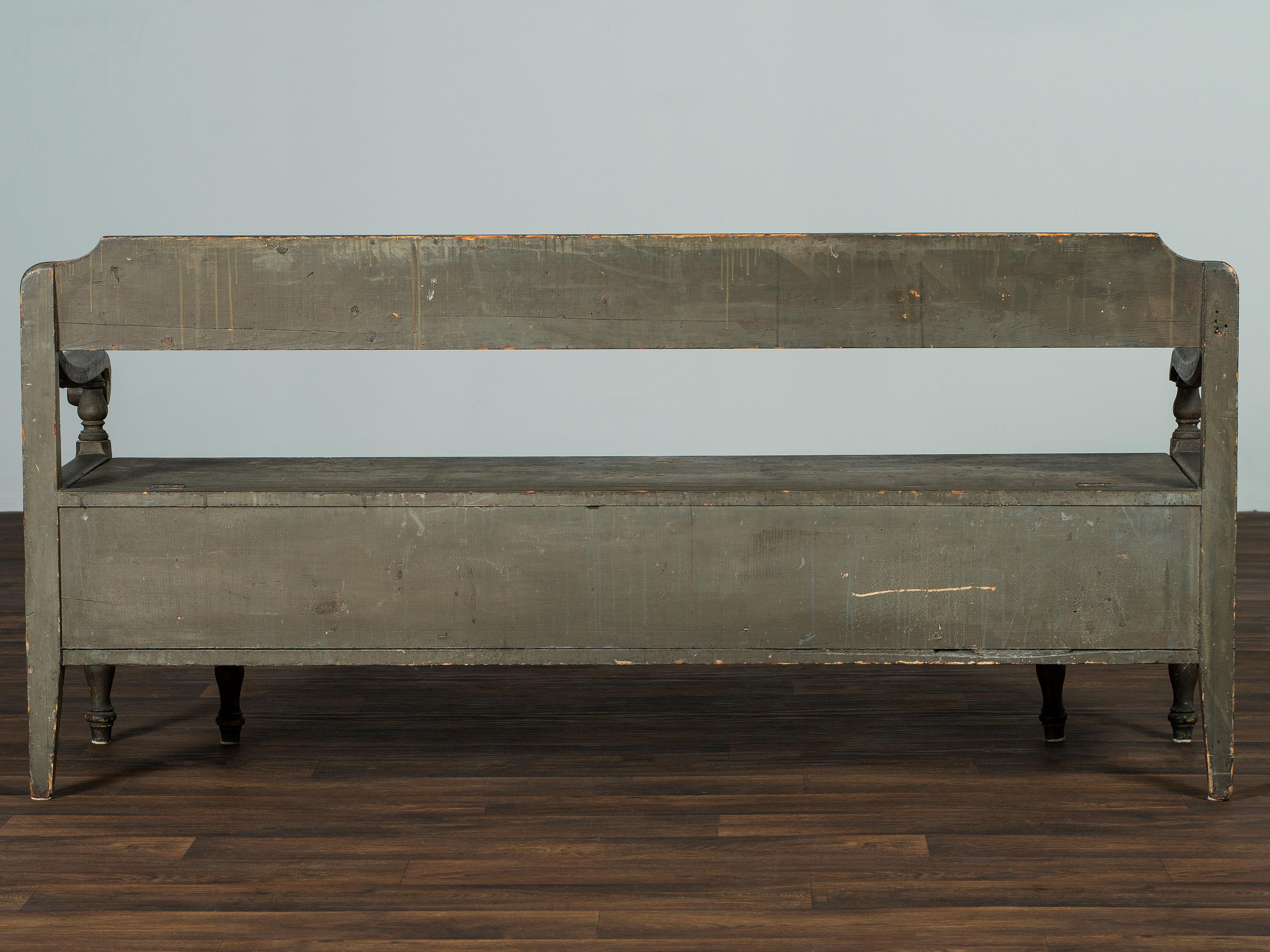 A Swedish-American Green Painted Pine Country Tavern Bench and Trundle Bed