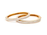 PAIR OF BICOLOR GOLD AND DIAMOND BANGLE BRACELETS