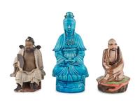 Three Chinese Porcelain and Stoneware Figures of Immortals