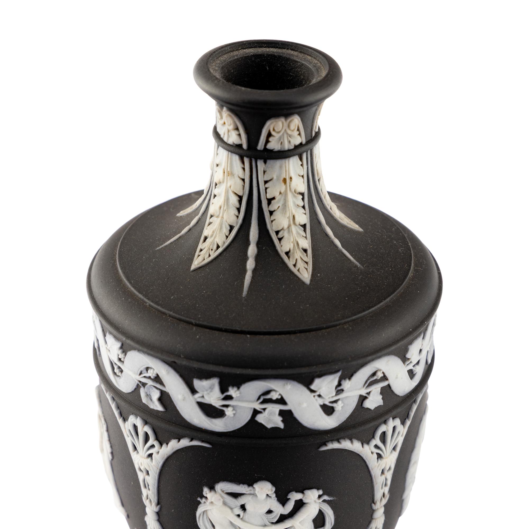 A Pair of Wedgwood Black Jasperware Urns