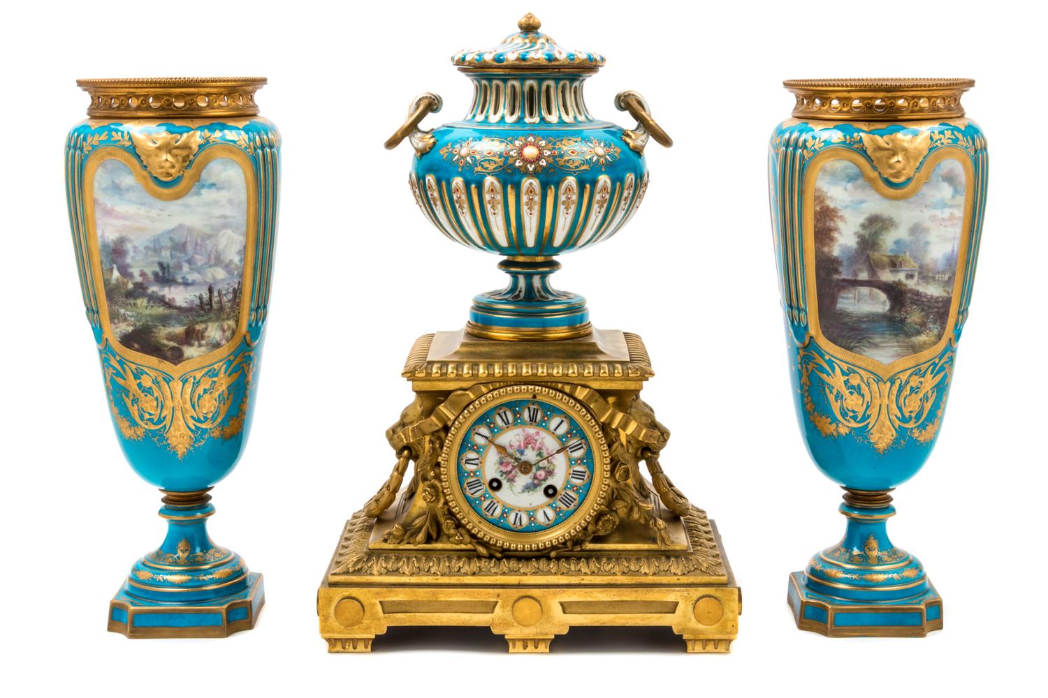 An Assembled French Gilt Bronze Mounted Porcelain Clock Garniture Height of clock 16 1/2 inches, height of vases 14 3/4 inches. — 19TH/20TH CENTURY