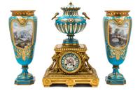 An Assembled French Gilt Bronze Mounted Porcelain Clock Garniture Height of clock 16 1/2 inches, height of vases 14 3/4 inches. — 19TH/20TH CENTURY
