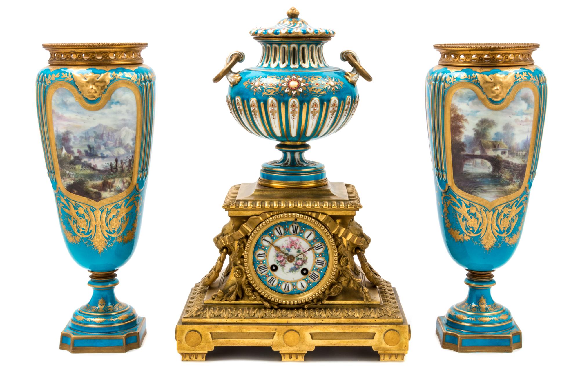 An Assembled French Gilt Bronze Mounted Porcelain Clock Garniture Height of clock 16 1/2 inches, height of vases 14 3/4 inches. — 19TH/20TH CENTURY