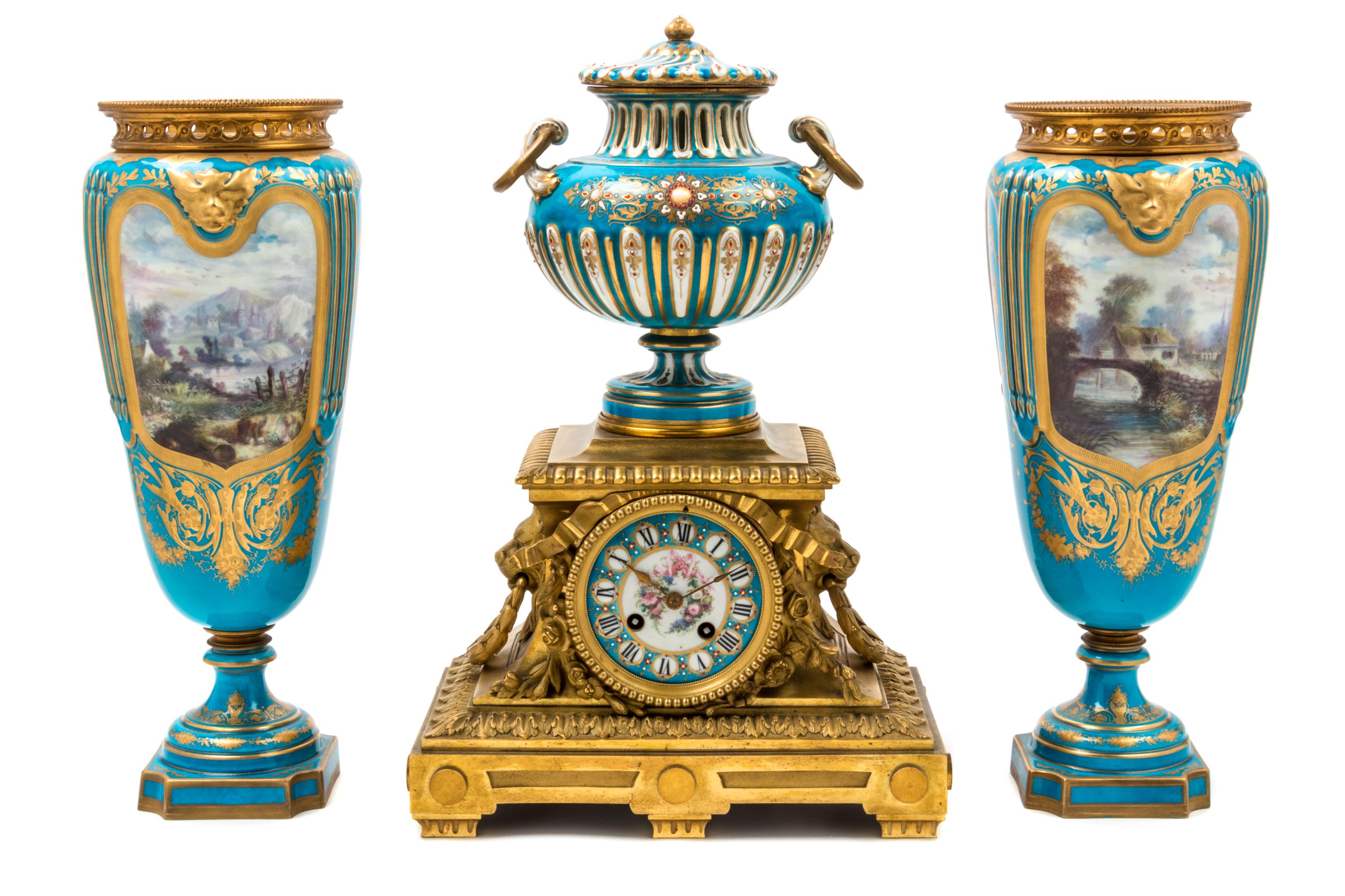 An Assembled French Gilt Bronze Mounted Porcelain Clock Garniture Height of clock 16 1/2 inches, height of vases 14 3/4 inches. — 19TH/20TH CENTURY