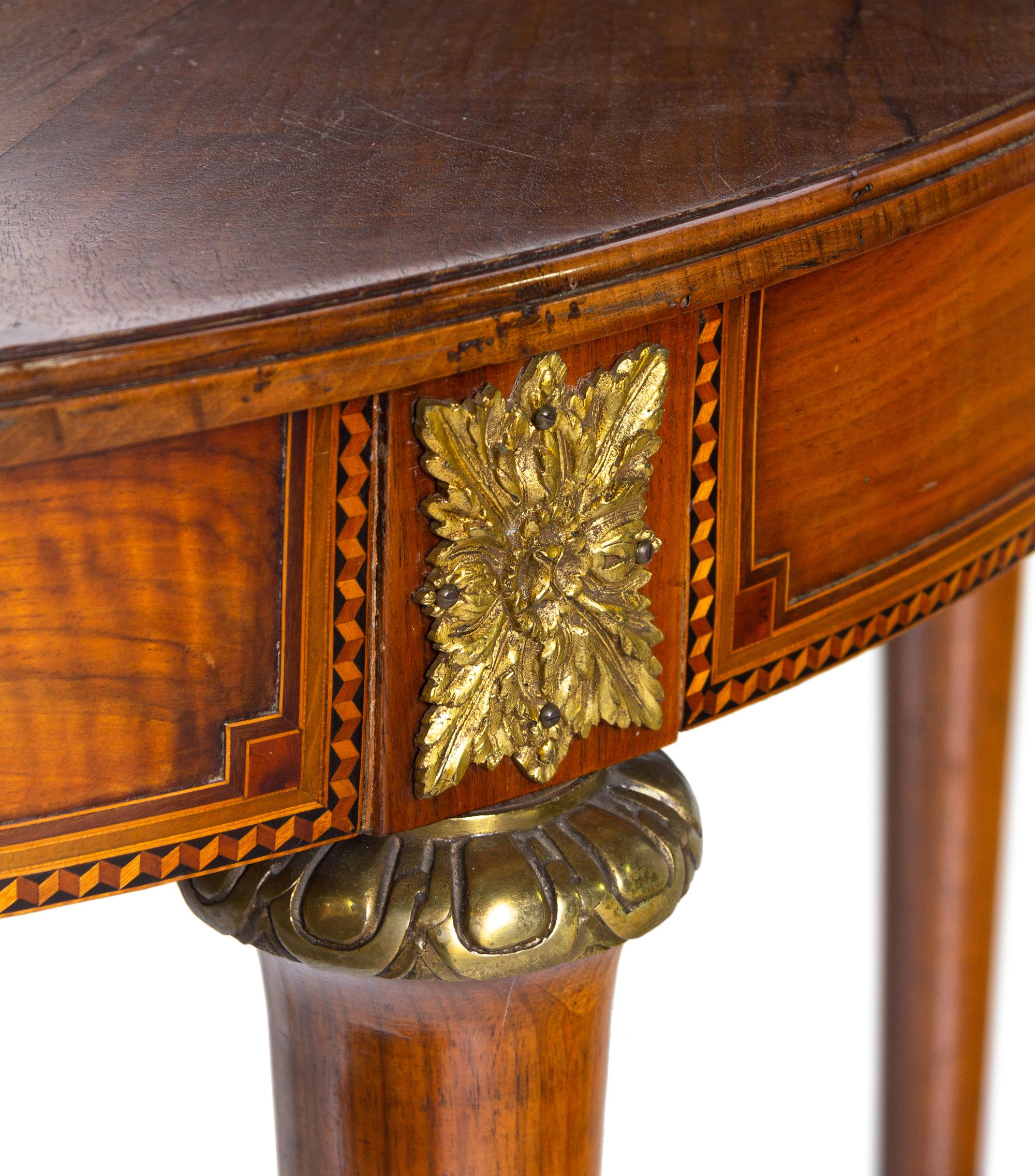 A Louis XVI Style Gilt Metal Mounted Walnut and Marquetry Extension Dining Table