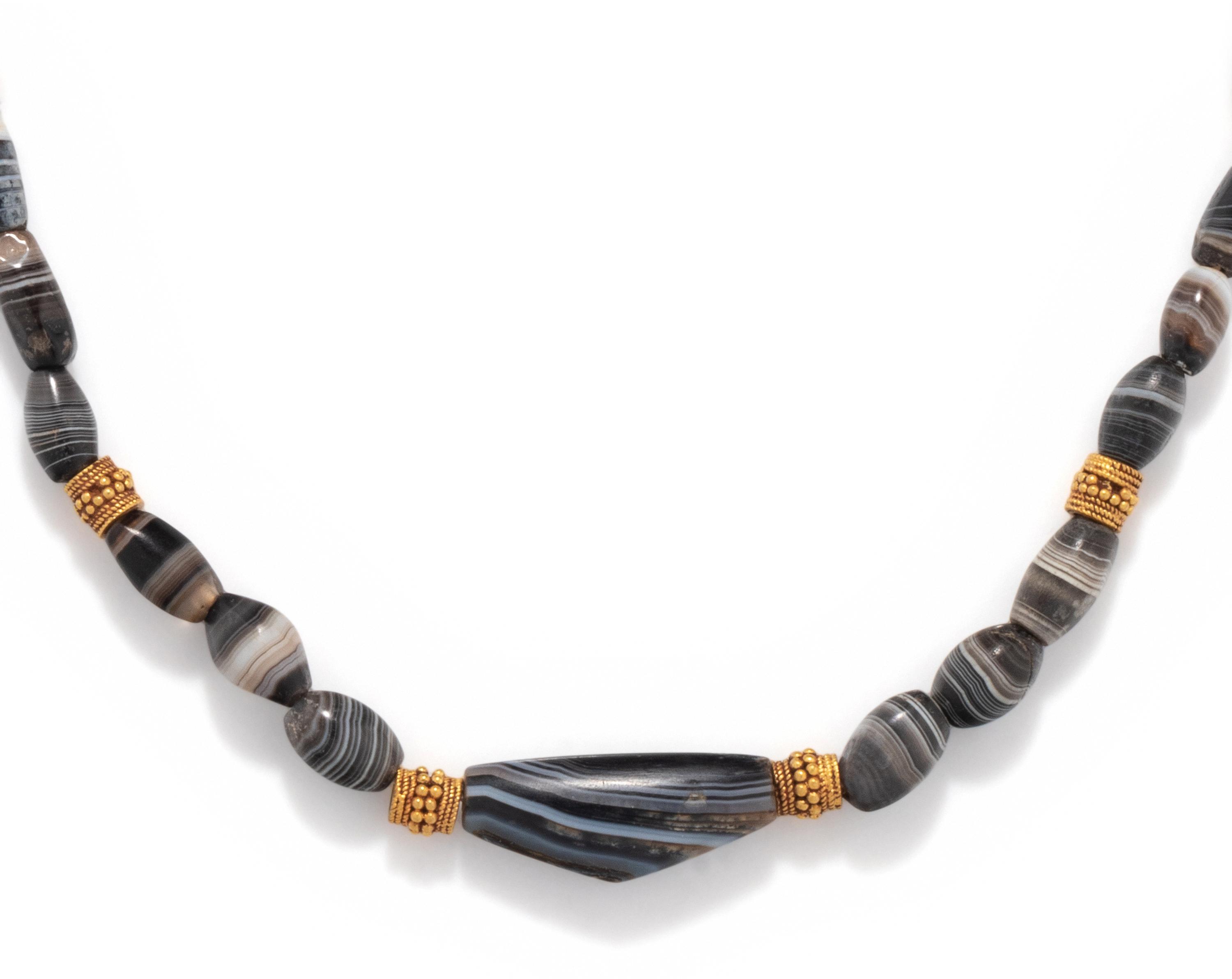 A Western Asiatic Agate and Gold Bead Necklace
