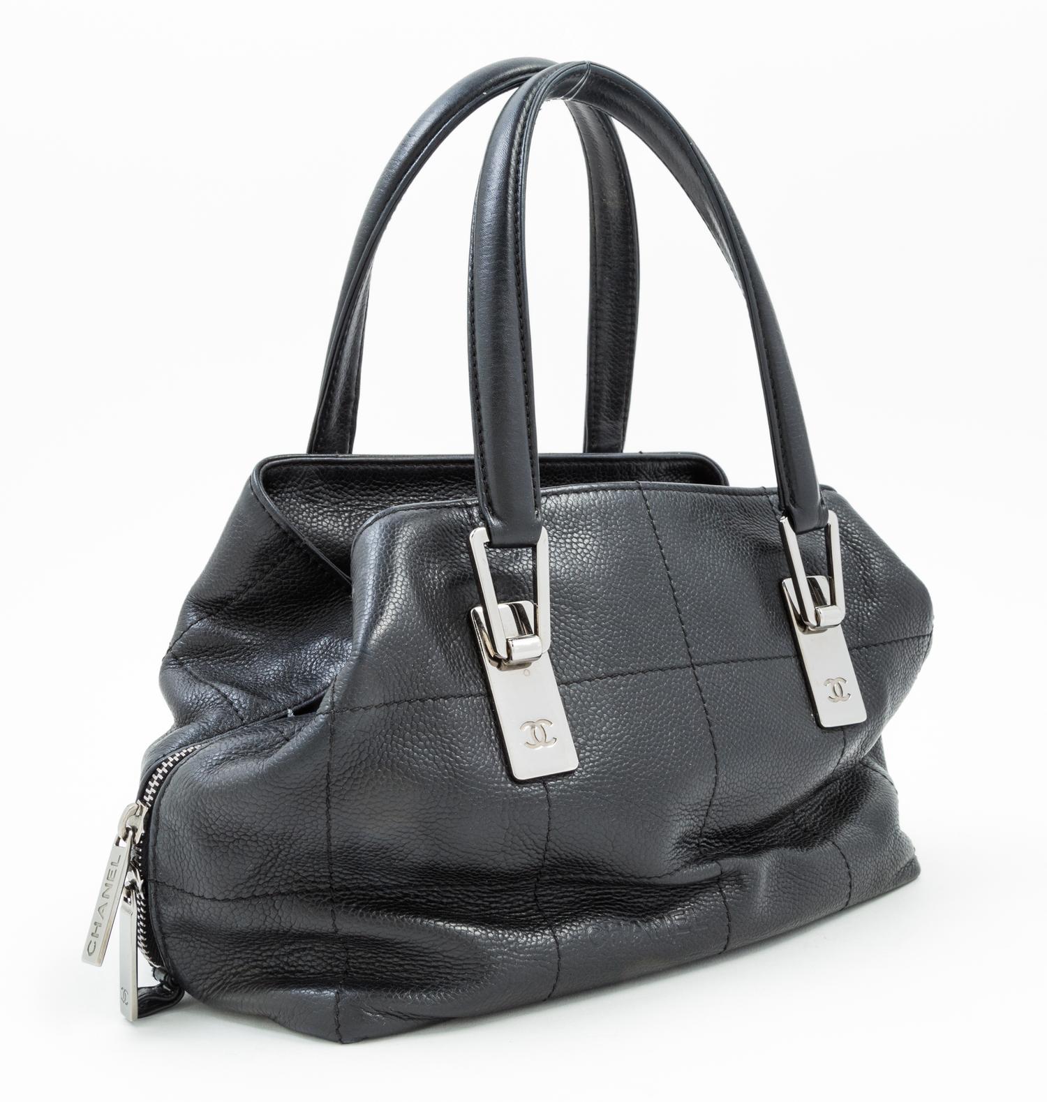 A Chanel Black Leather Handbag, 9.5" x 7" 5"; Handle drop: 5.5".