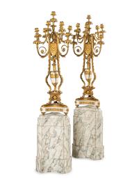 A Pair of Louis XVI Style Gilt Bronze and White Marble Ten-Light Candelabra