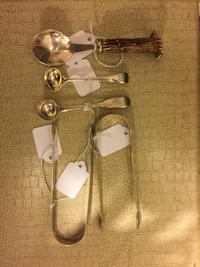 Three Georgian Silver Table Articles, Various makers and dates, London, comprising two sugar tongs and a sugar spoon, together with a V