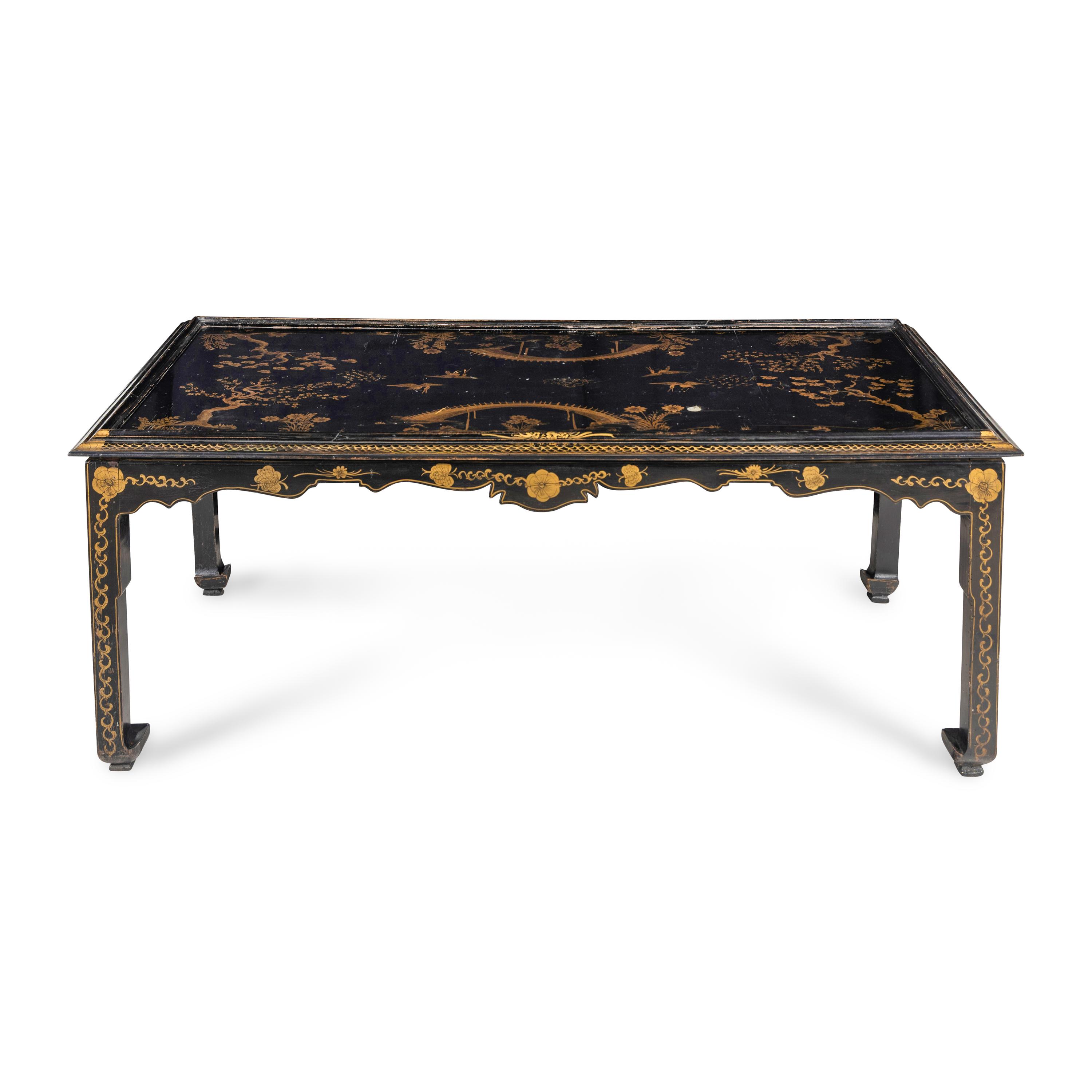 A Modern Parcel Gilt and Black Lacquered Chinoiserie Decorated Scroll Foot Table