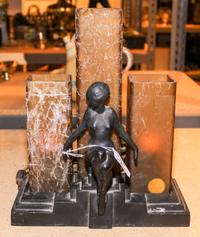 An Art Deco Cast Metal Figural Lamp Height with base 10 1/2 inches.