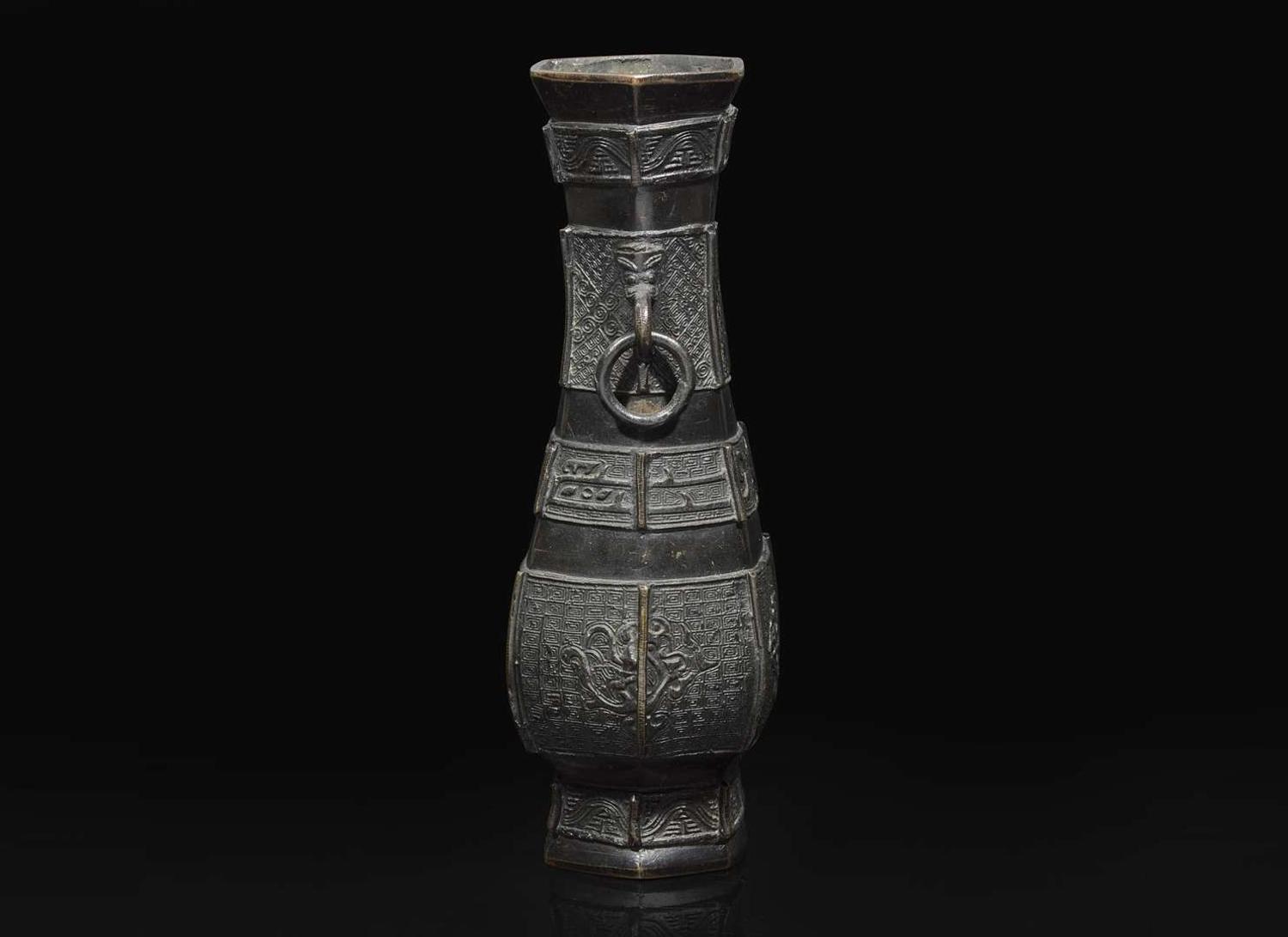 A Chinese patinated bronze hexagonal vase, Yuan to Ming Dynasty 加漆六方銅瓶 元或明