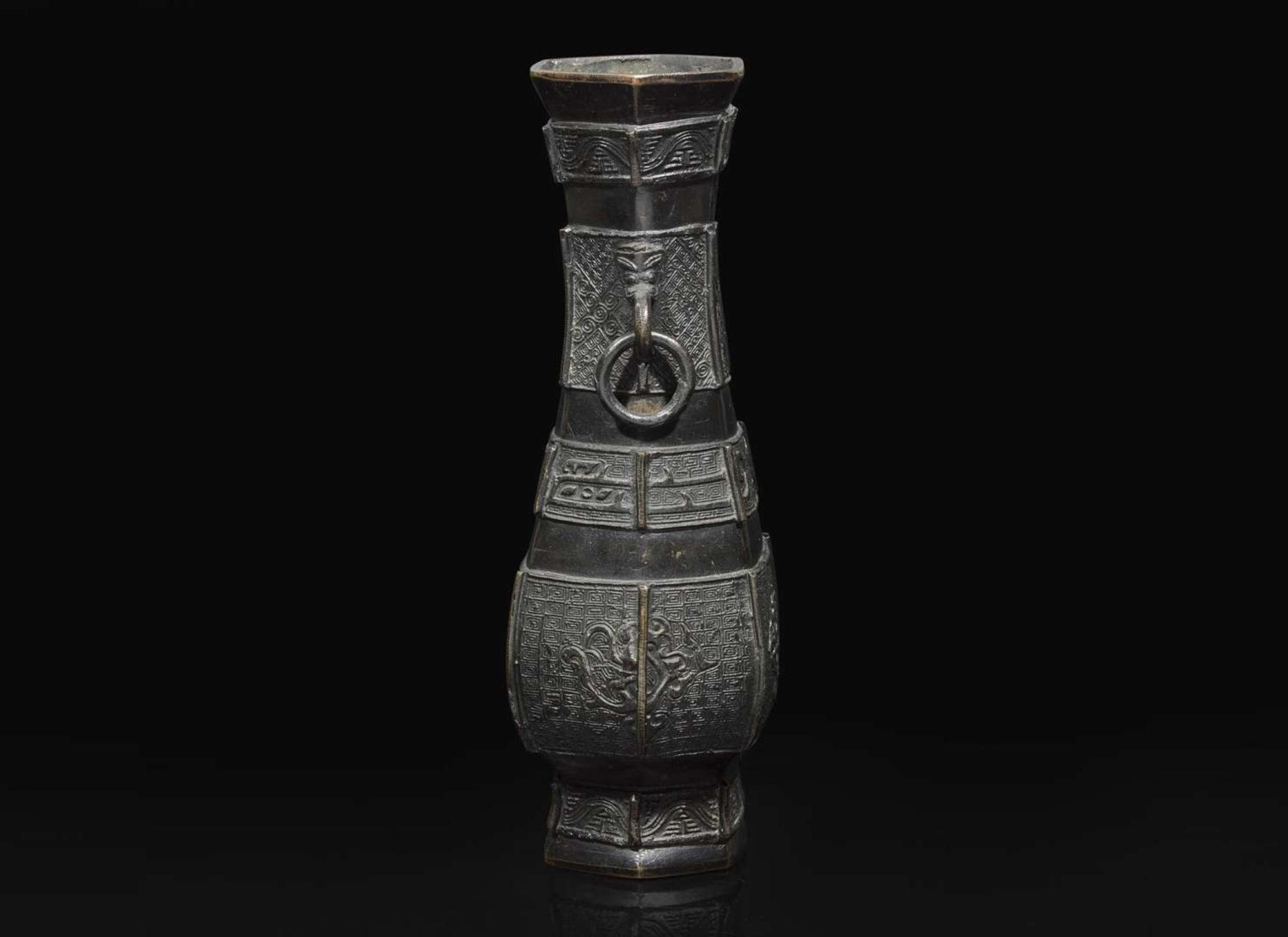 A Chinese patinated bronze hexagonal vase, Yuan to Ming Dynasty 加漆六方銅瓶 元或明