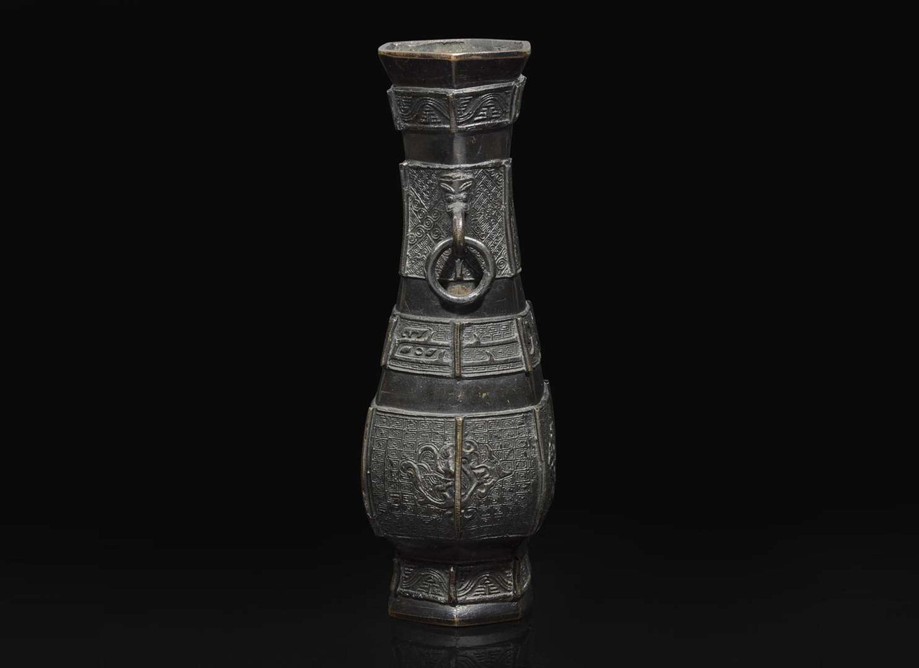 A Chinese patinated bronze hexagonal vase, Yuan to Ming Dynasty 加漆六方銅瓶 元或明