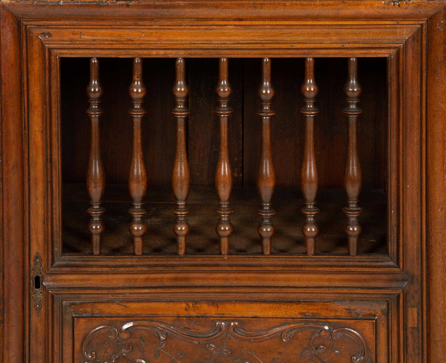 A French Provincial Carved Walnut Panettière