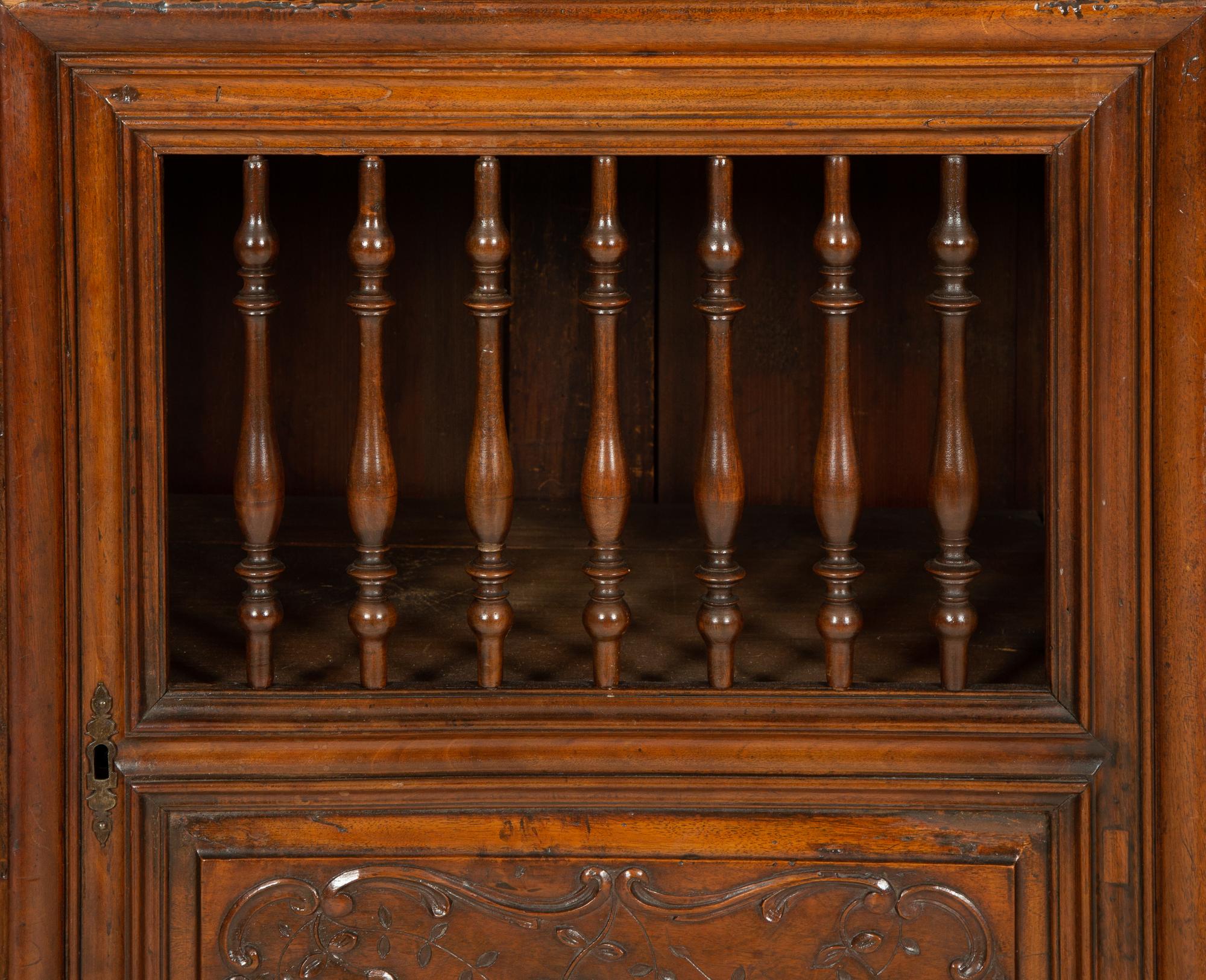A French Provincial Carved Walnut Panettière