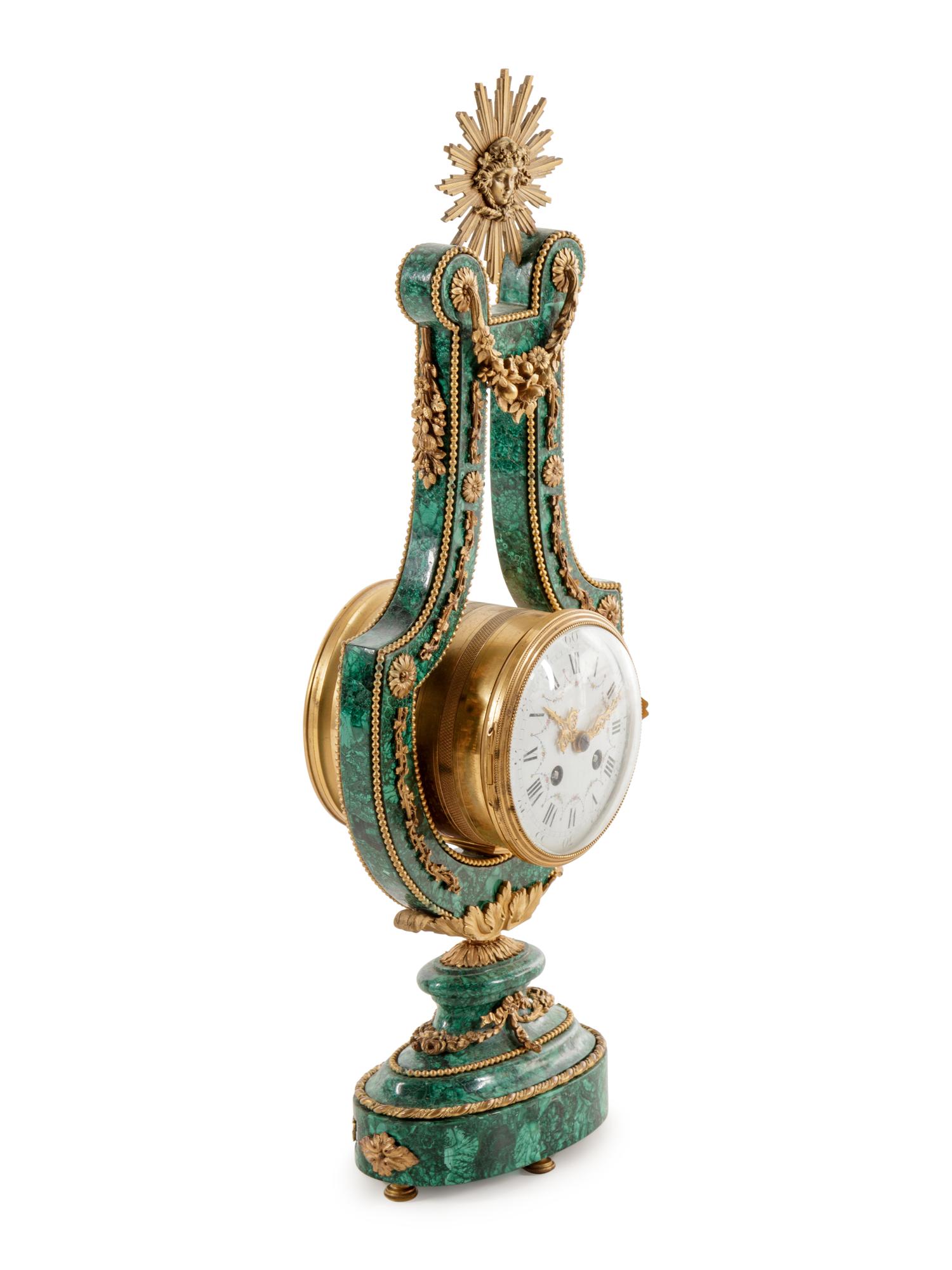 A Louis XIV Style Gilt Metal Mounted Malachite Veneered Harp Clock