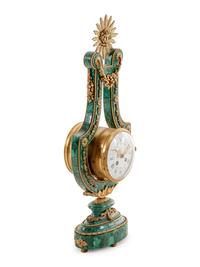A Louis XIV Style Gilt Metal Mounted Malachite Veneered Harp Clock