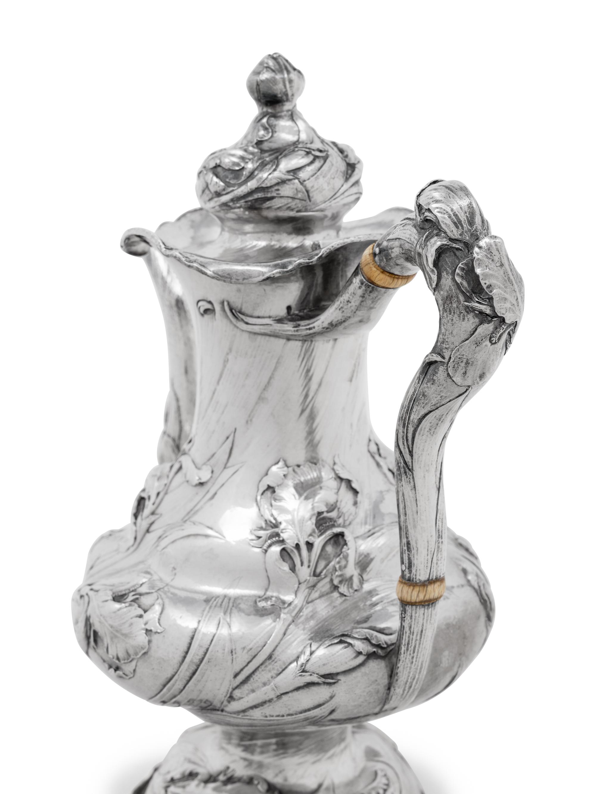 An American Silver Repoussé Eight-Piece Tea and Coffee Service