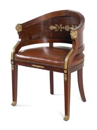An Empire Style Gilt Metal Mounted Mahogany Bureau Plat and an Associated Armchair