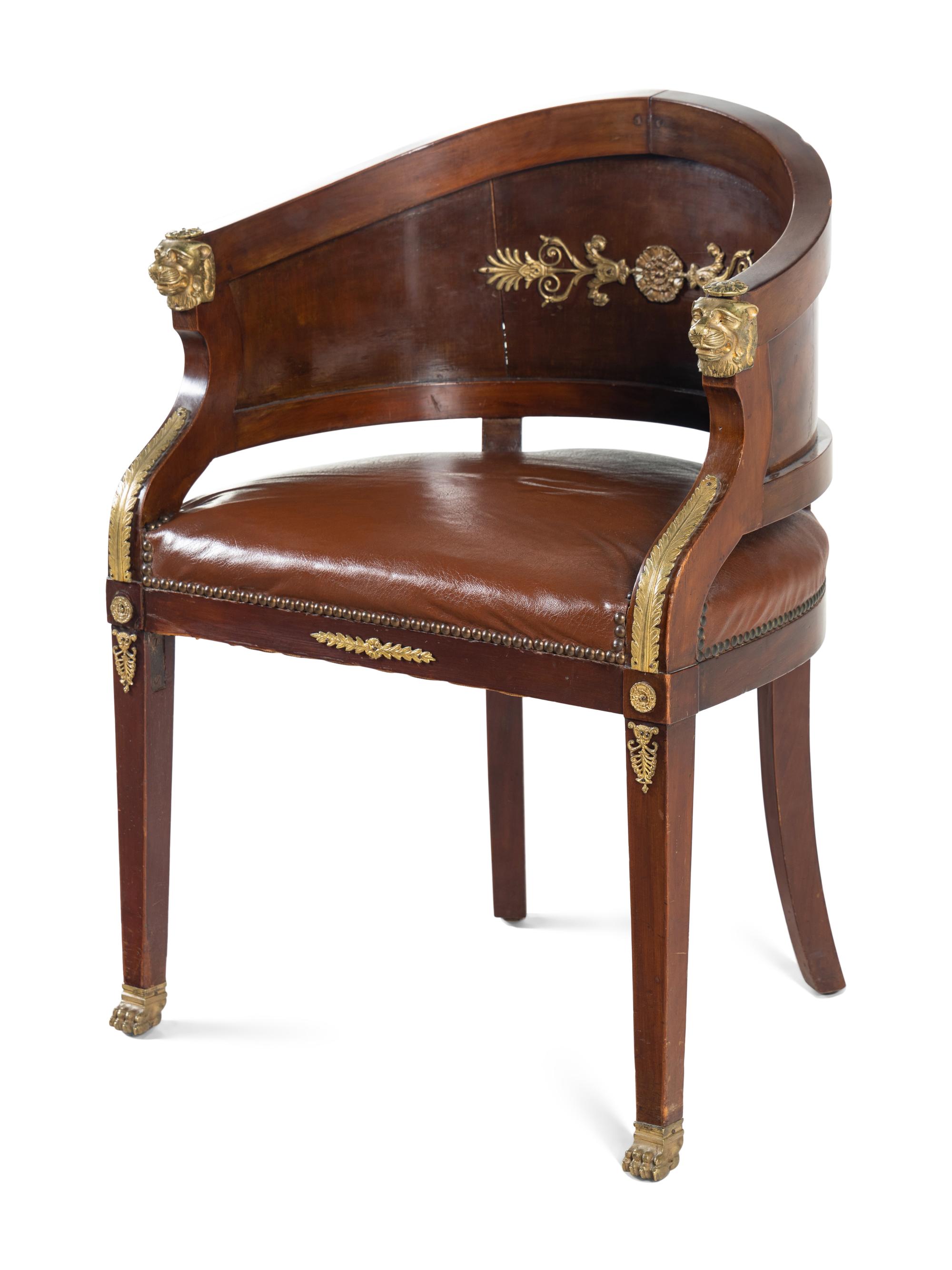 An Empire Style Gilt Metal Mounted Mahogany Bureau Plat and an Associated Armchair