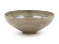A Slip Decorated Celadon Glazed Ceramic Bowl