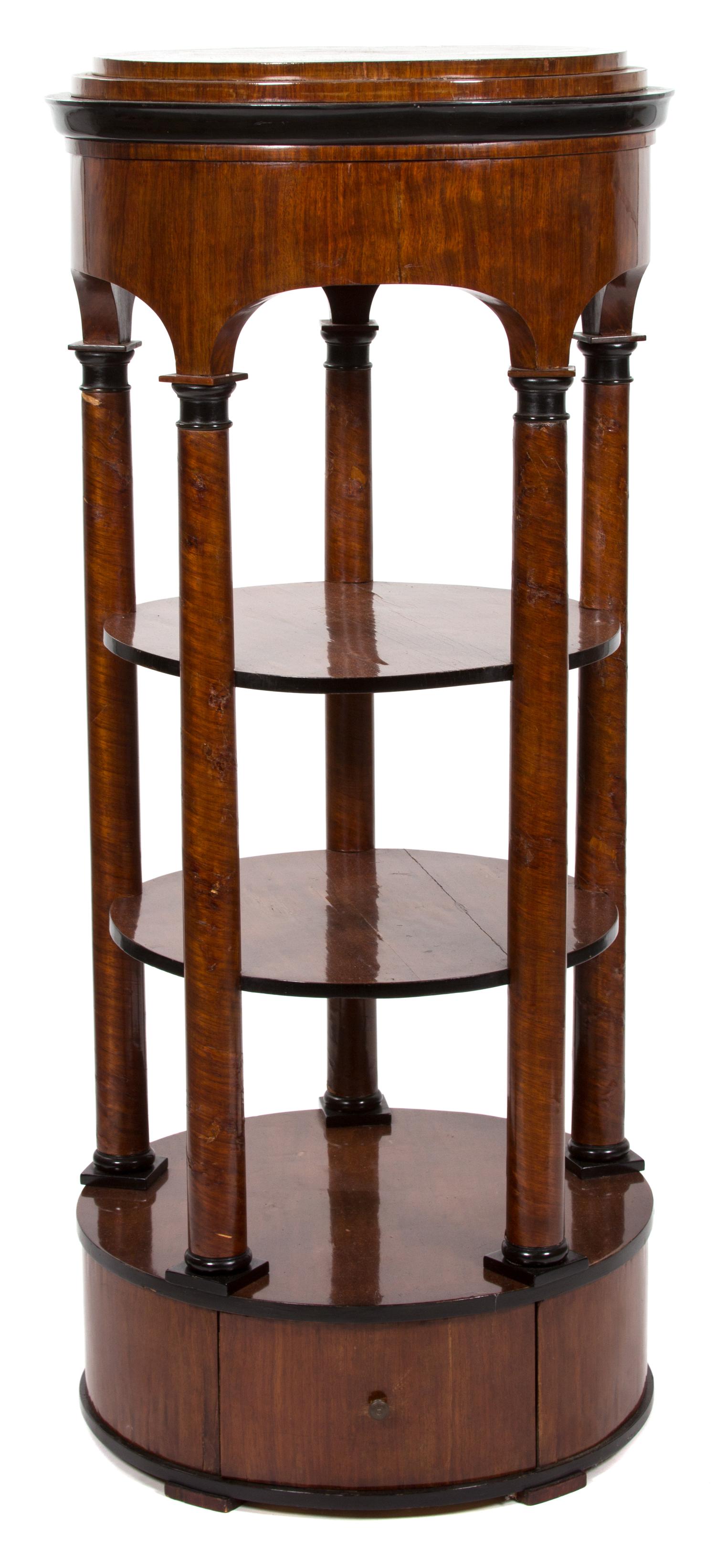 A Biedermeier Mahogany and Partially Ebonized Circular Three-Tier Etagere Height 59 x diameter 26 inches. — 19TH CENTURY