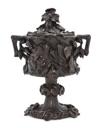 A Continental Patinated Bronze Covered Urn, Height 8 1/2 inches.