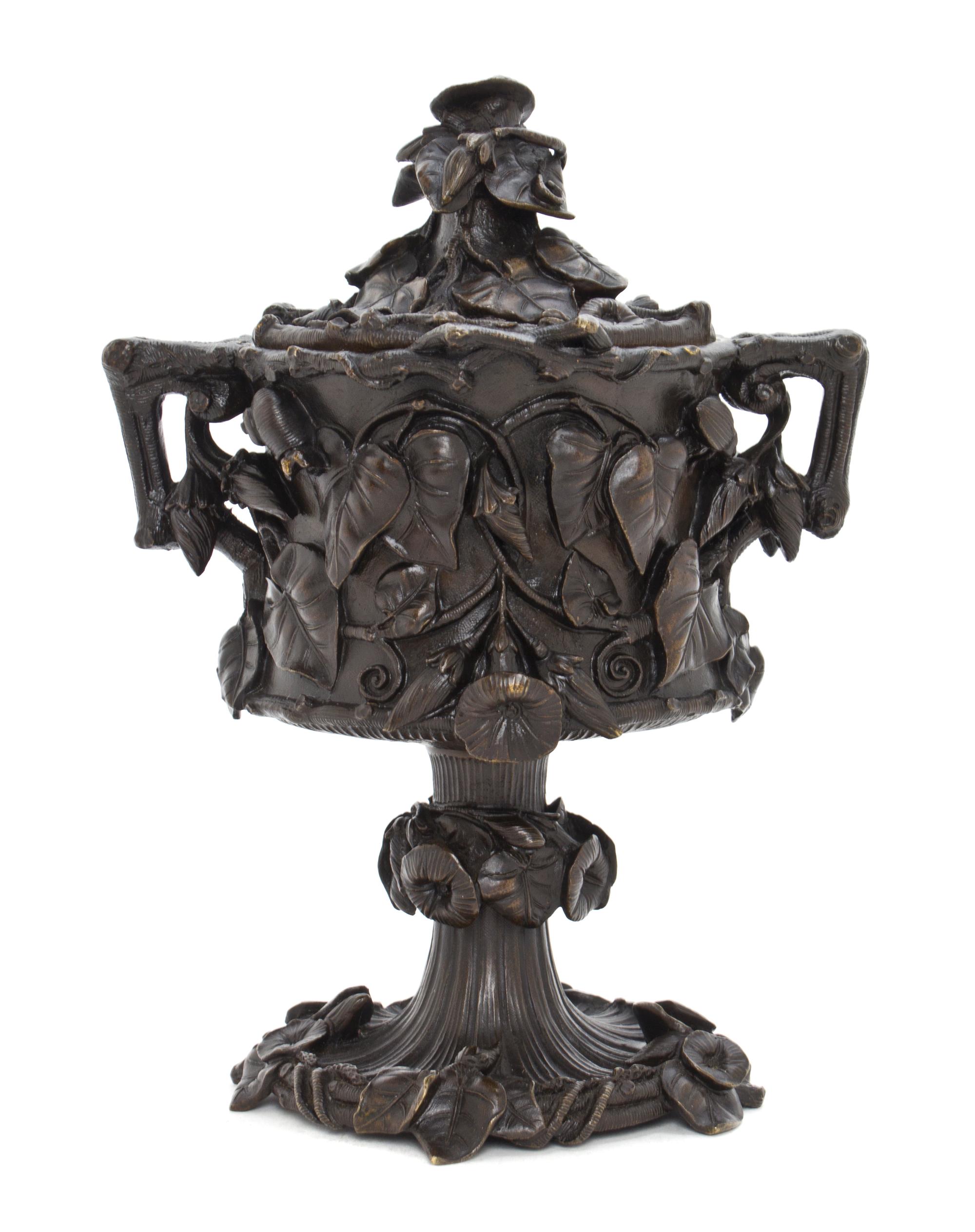 A Continental Patinated Bronze Covered Urn, Height 8 1/2 inches.