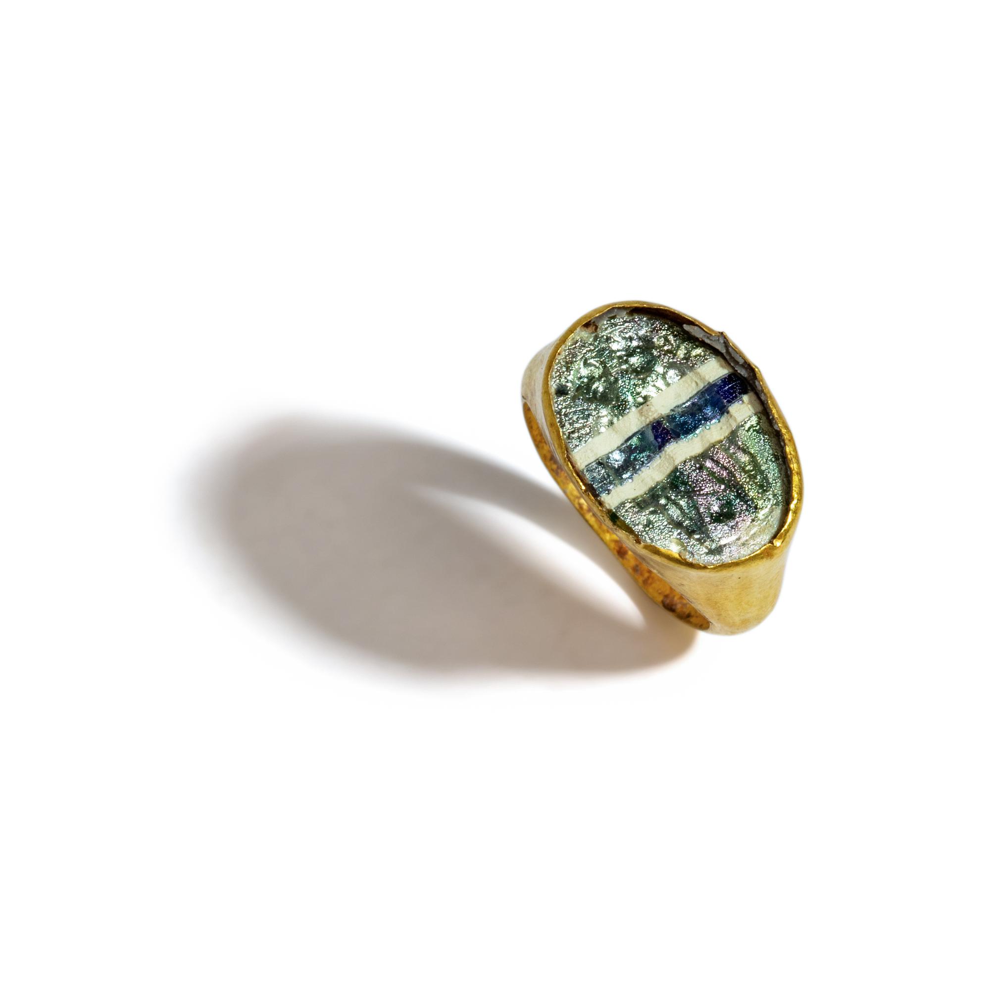 A Roman Glass and Gold Finger Ring with Two Athletes