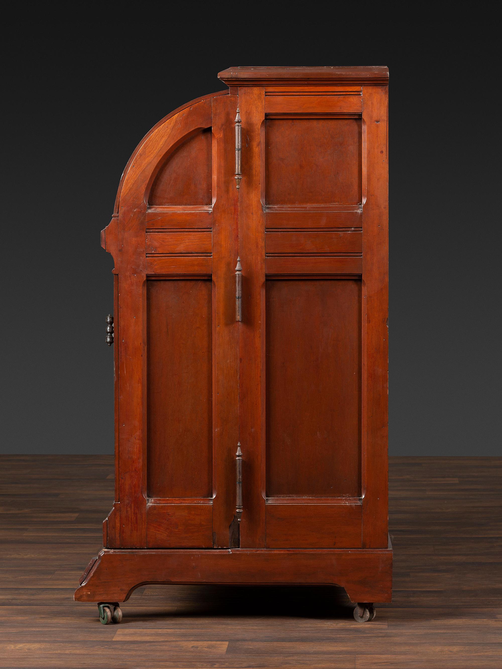 A Carved Walnut Wooton Secretary Desk
