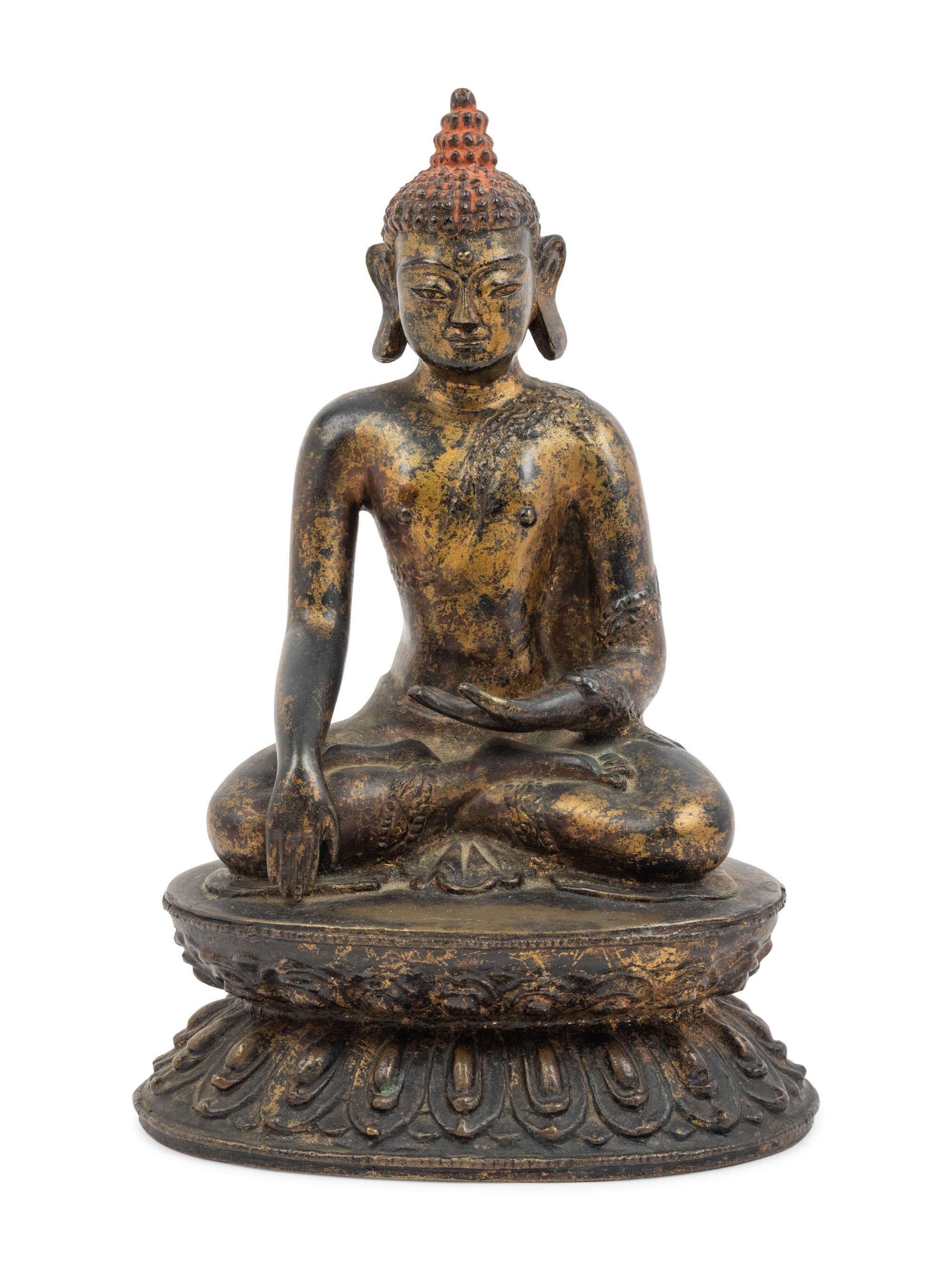 A Large Nepalese Gilt Bronze Figure of Seated Buddha