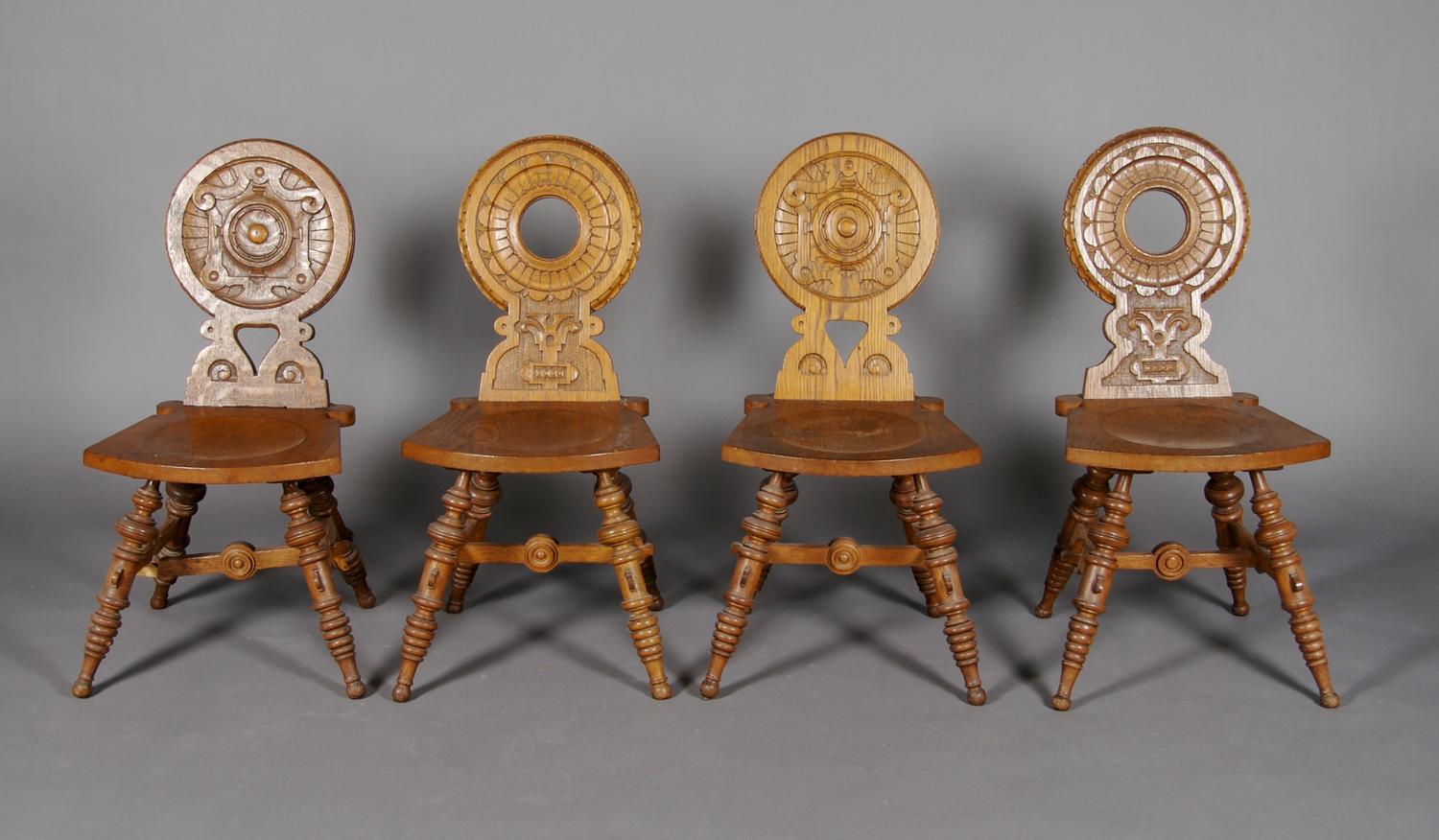 A Set of Four Oak Hall Chairs, Height 34 1/2 inches.