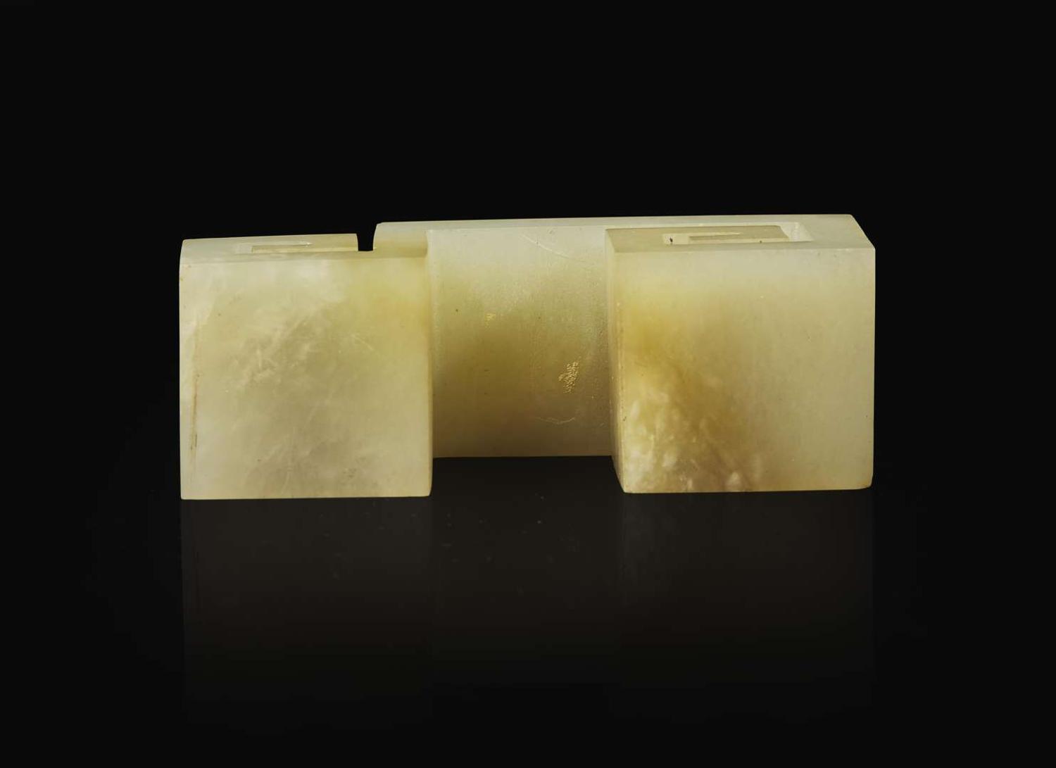 A Chinese carved celadon jade "Scroll" brush rest, Qing dynasty 青玉筆架一件 清