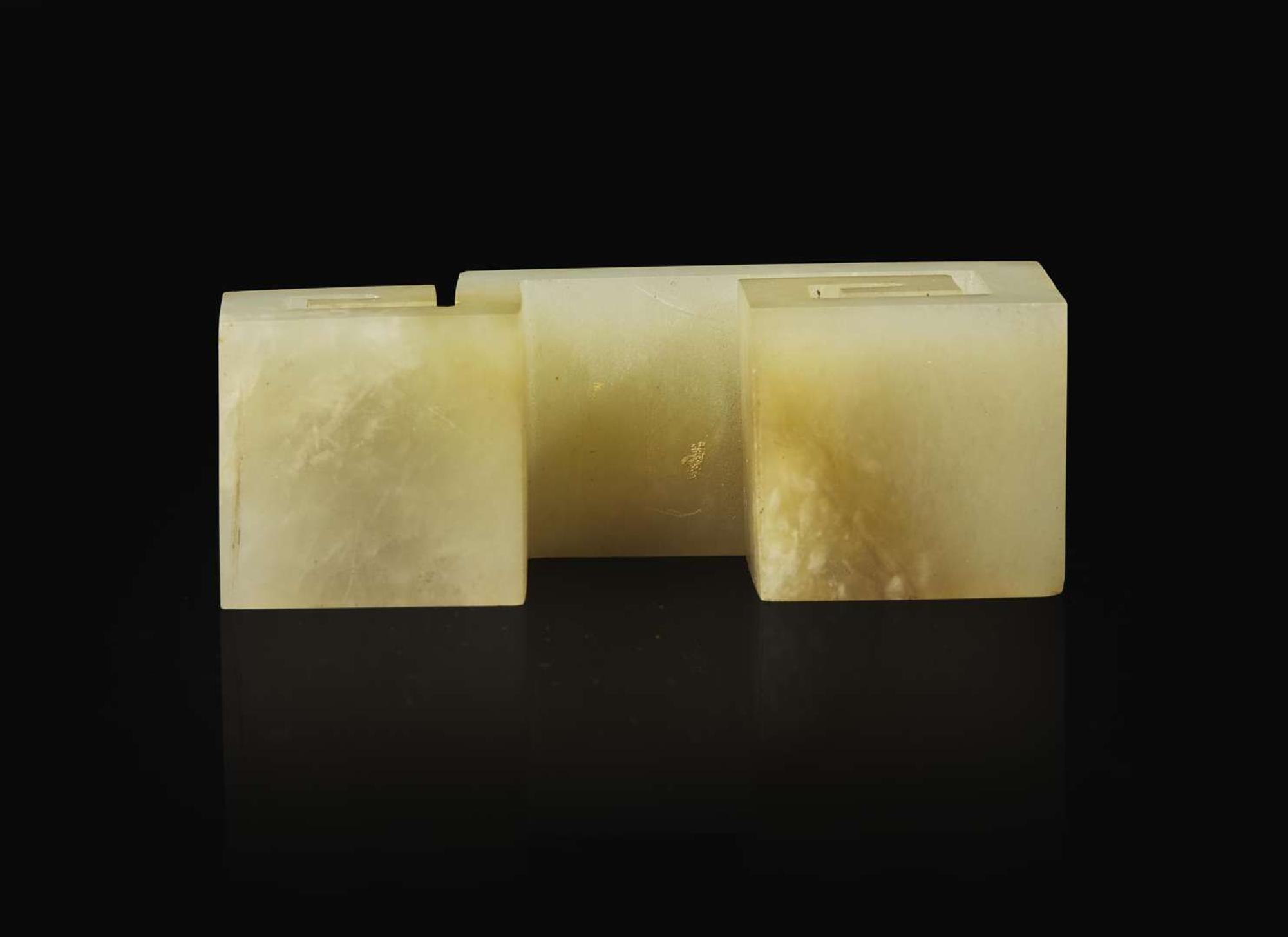 A Chinese carved celadon jade "Scroll" brush rest, Qing dynasty 青玉筆架一件 清