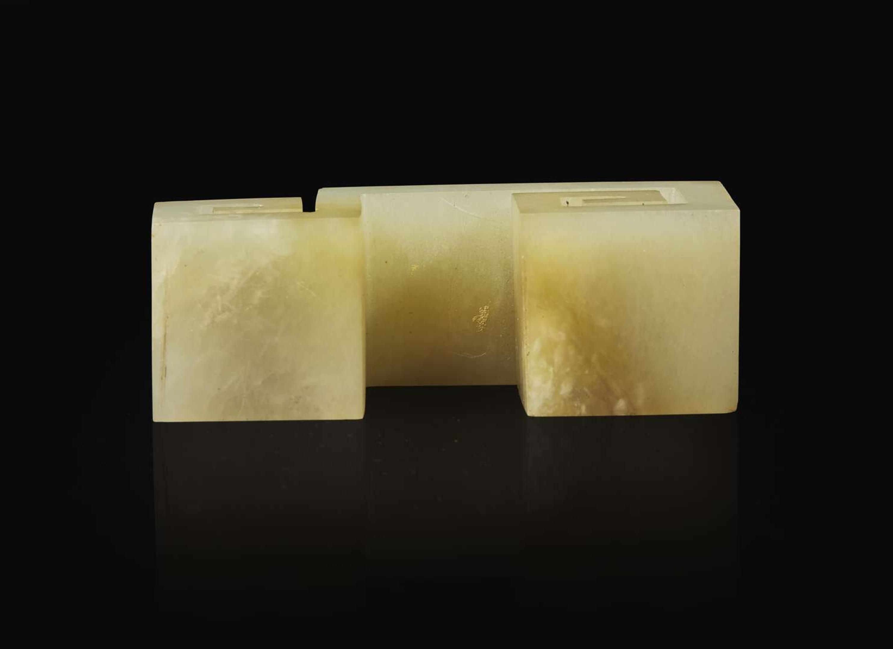 A Chinese carved celadon jade "Scroll" brush rest, Qing dynasty 青玉筆架一件 清