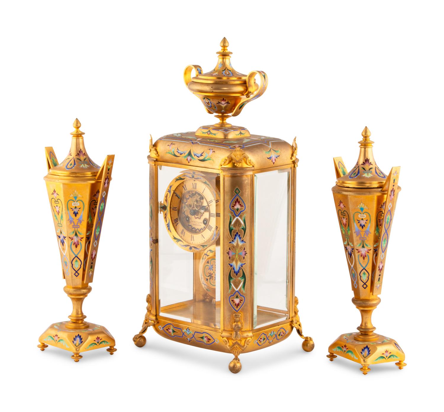 An English Champlevé Enamel and Gilt Bronze Clock Garniture