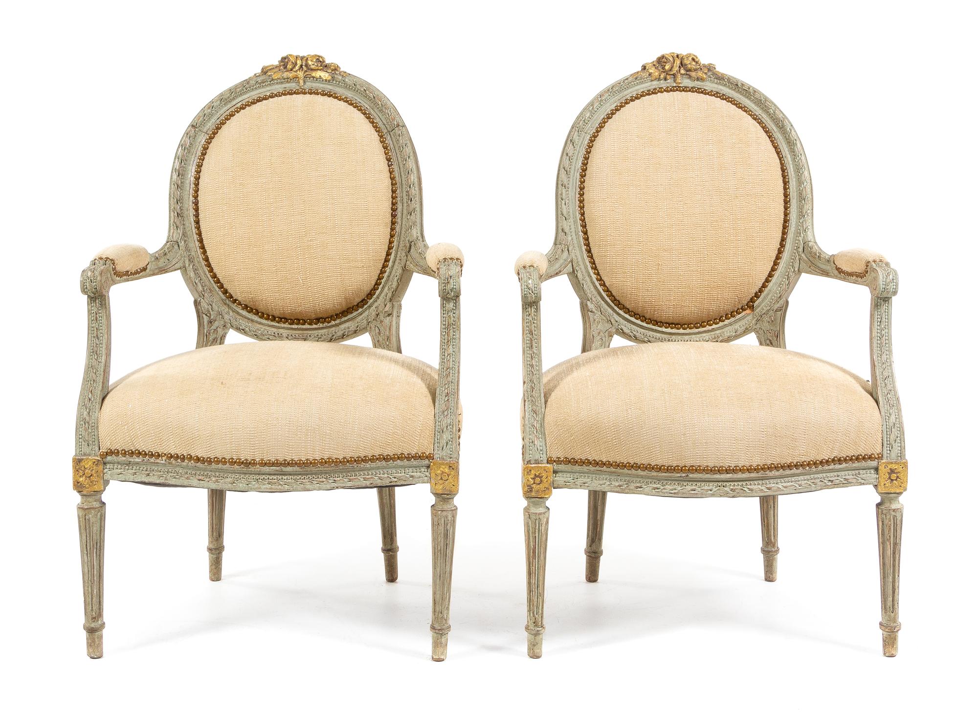 A Pair of Louis XVI Style Painted and Parcel Gilt Fauteuils Height 37 inches. — MID-19TH CENTURY