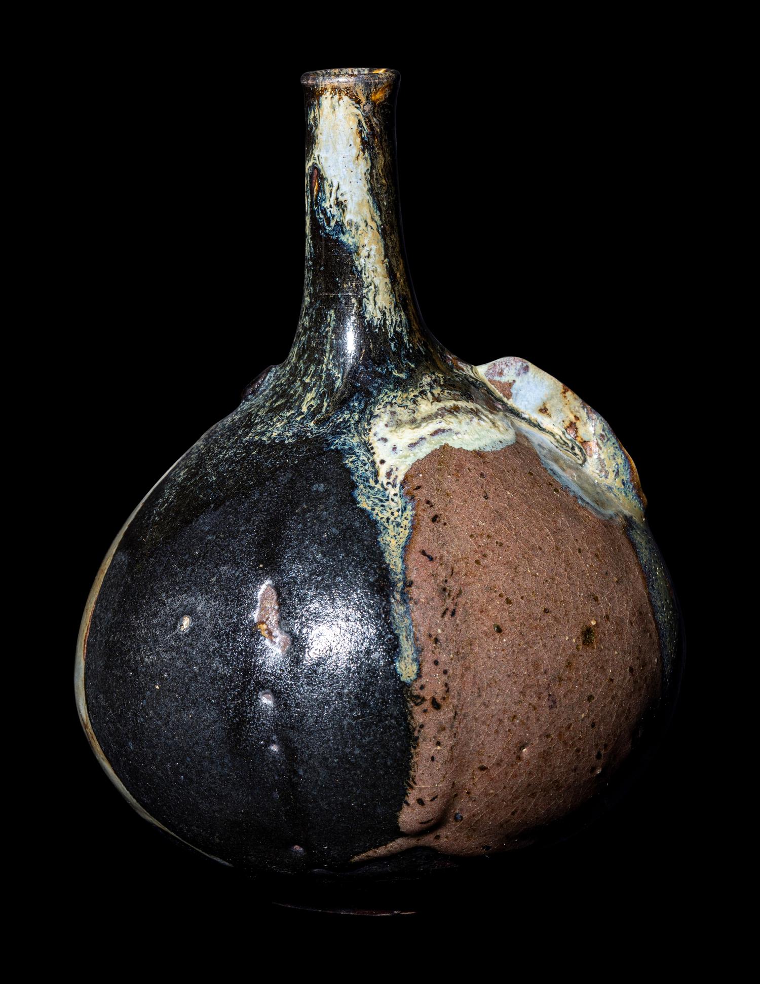 A Japanese Dark Brown Glazed Stoneware Bottle Vase