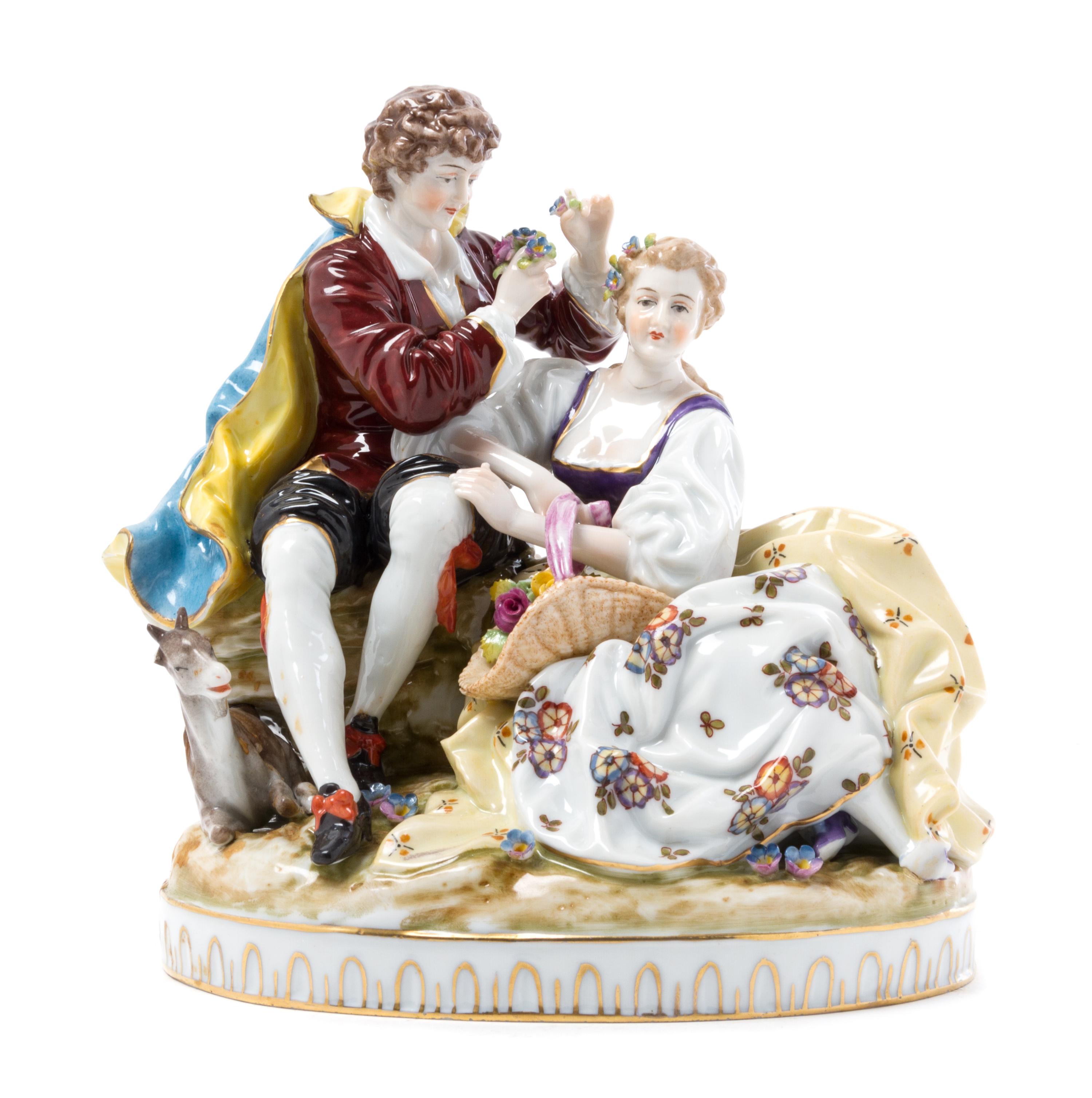 A Continental Porcelain Figural Group Height 8 inches.