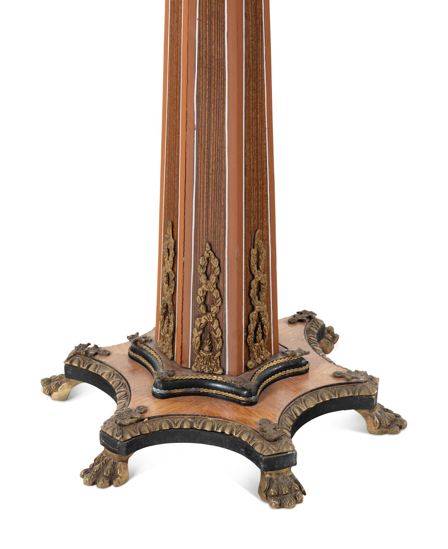 An Empire Style Gilt Metal Mounted Fruitwood Pedestal Table