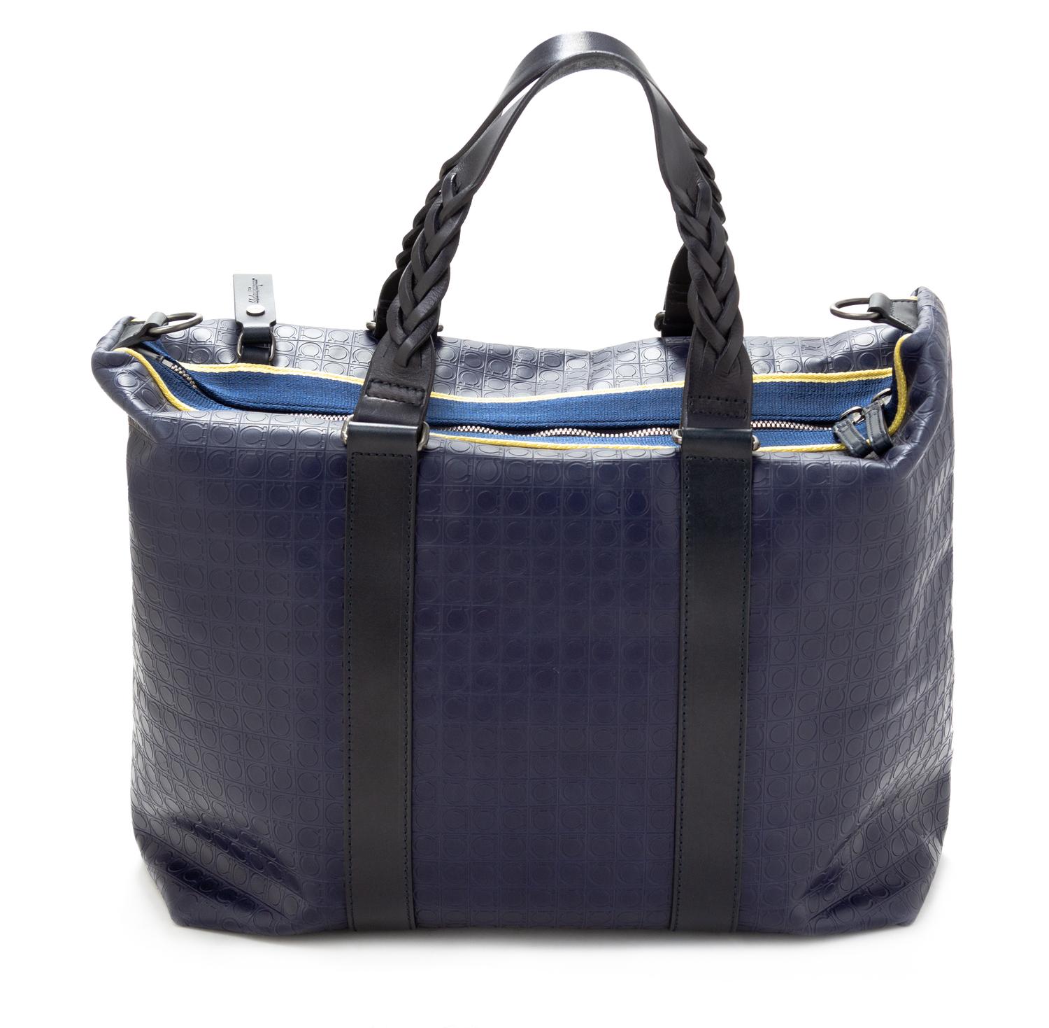 A Salvatore Ferragamo Navy Logo Embossed Leather Tote Bag, 11"H x 15"W x 7.25"D; Strap drop: 8".