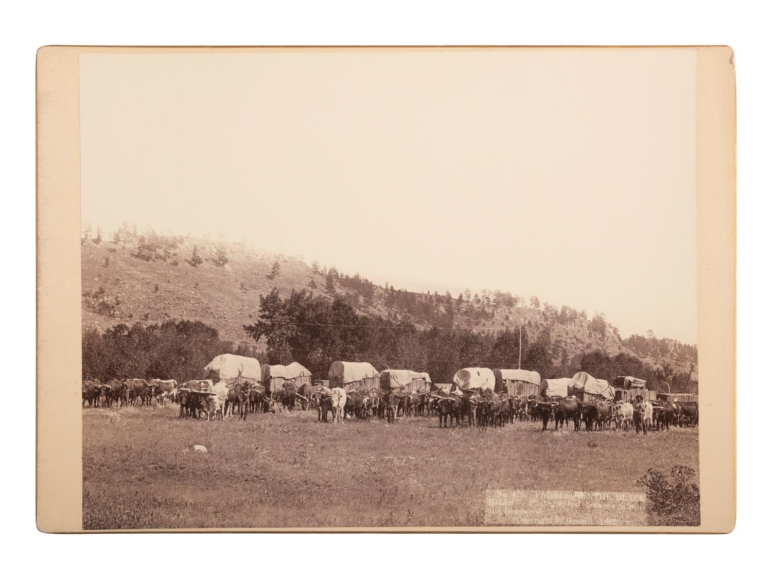 [WESTERN AMERICANA]. GRABILL, John C.H. (1849-1903), photographer. Freighting in "The Black Hills." Photographed between Sturgis and Deadwood. [South Dakota], 1887.