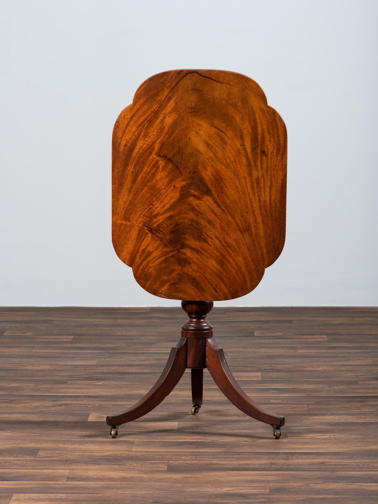 A Late Chippendale Figured Mahogany Tablet Tilt-Top Candlestand