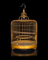 A Chinese Bamboo Bird Cage with A Pair of Wucai Porcelain Bird Feeders
