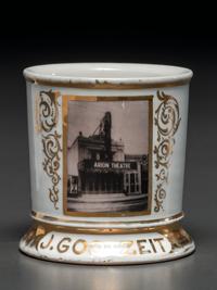 A Photographic Transfer Porcelain Shaving Mug Depicting the Arion Theatre, New York