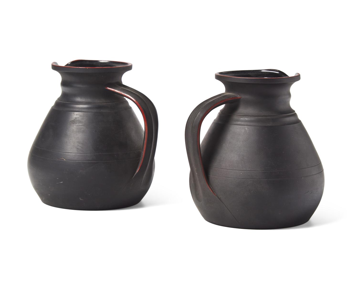 A Pair of Wedgwood Black Basalt "Golf Girls" Decorated Kenlockware Jugs